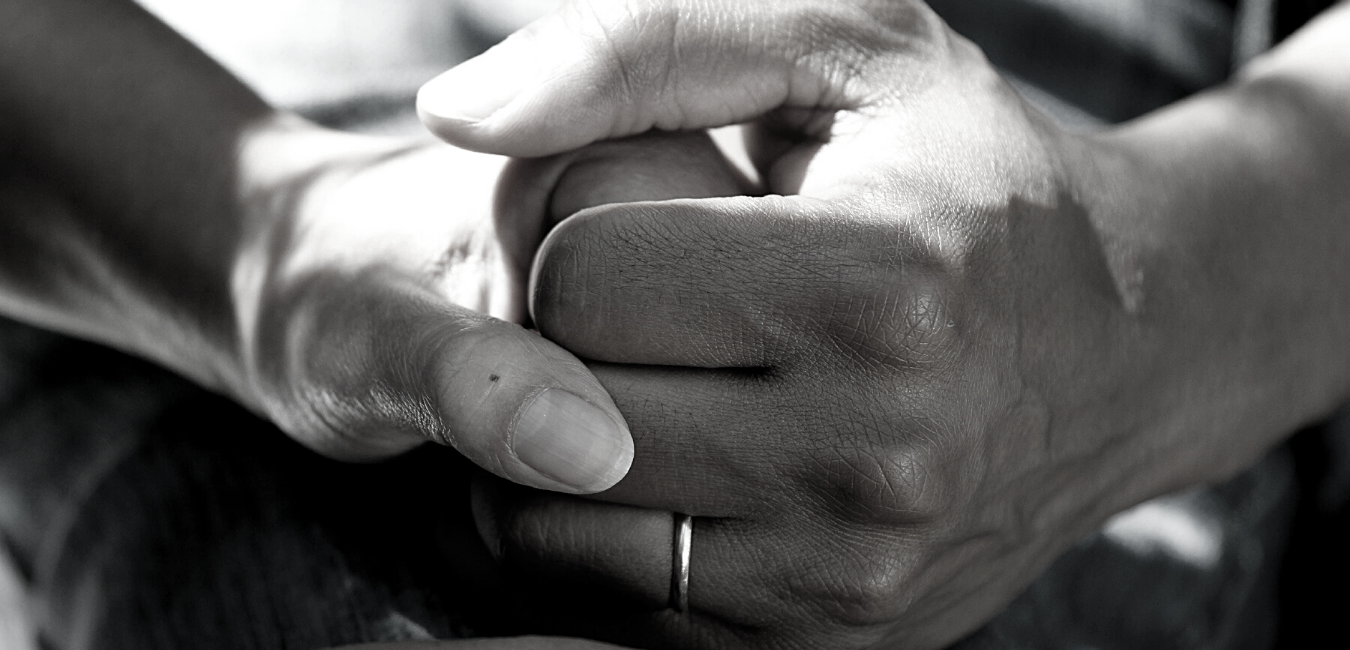 provider holding patient hand